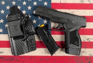 Used Taurus GX4XL 9mm pistol package with magazine and holster